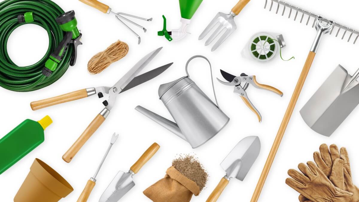 A broad selection of garden tools laid out in a pattern on a white background.